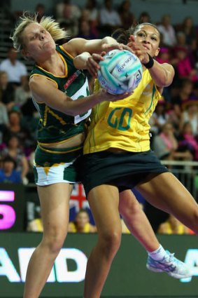 Fast and furious: South Africa's Maryka Holtzhausen and Chanel Gomes, of Australia, compete for  the ball.