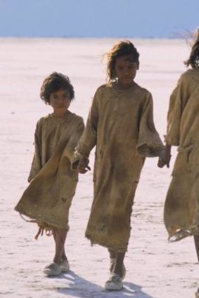 Great escape: Tianna Sansbury, left, Laura Monaghan and Everlyn Sampi walk across a dry salt lake in <i>Rabbit-Proof Fence</i>.