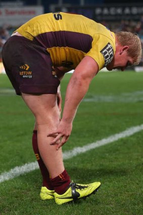 In doubt for Origin: Broncos prop Ben Hannant leaves the field with a leg injury on Saturday night.