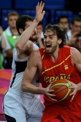 Banging bodies: Spain's Pau Gasol goes up against fellow NBA star Kevin Love in the gold medal game, won by the United States, at the 2012 London Olympics.