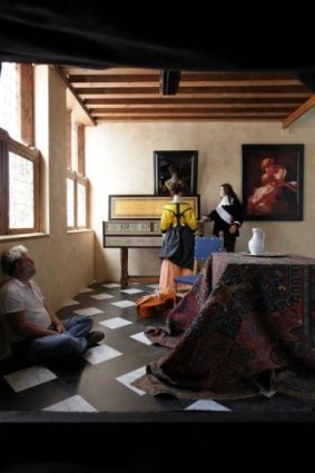 Tim Jenison takes a breather in the replica of Vermeer's studio he has built.