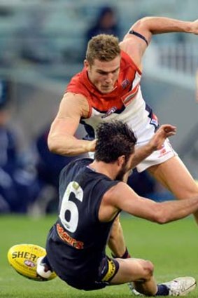 Melbourne's Luke Tapscott was reported for this bump on Carlton's Kade Simpson in round 6.