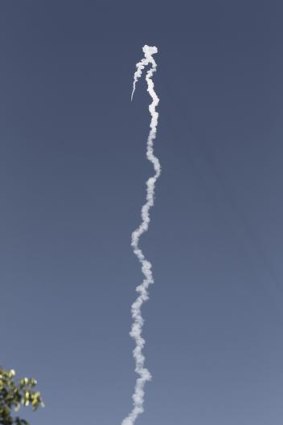 A trail of smoke is seen in the sky near Tel Aviv after Israel test-fired its new missile.