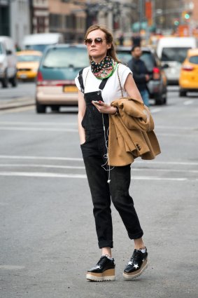 Industrial evolution ... Diane Kruger matches her overalls with a platform lace-up.