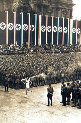 Then: a runner carries the Olympic flame into the centre of a Berlin firmly in the grip of National Socialism.