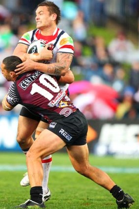 Smashed ... Manly's Brent Kite deals with Jared Waerea-Hargreaves.