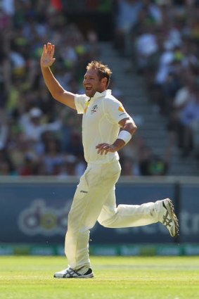 Ryan Harris of Australia celebrates the wicket of Ian Bell.