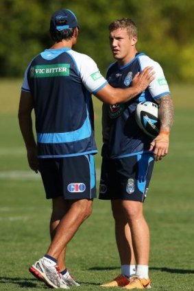 NSW coach Laurie Daley instructs halfback Trent Hodkinson at training.