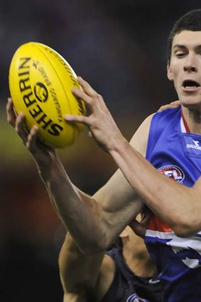 Bulldog Jarrad Grant is free to play in Sunday's imprtant clash with Brisbane after having his striking charge downgraded.
