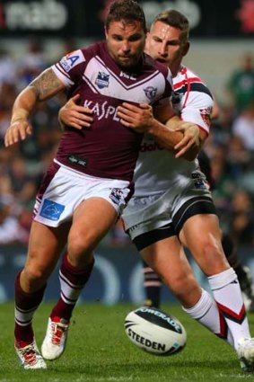 Contest ... Anthony Watmough of the Sea Eagles and Lewis Brown of the Warriors.