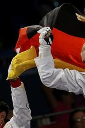 The victor ... Germany's Helena Fromm celebrates her bronze medal.