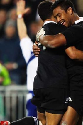Julian Savea of the All Blacks celebrates with Aaron Smith after scoring a try.