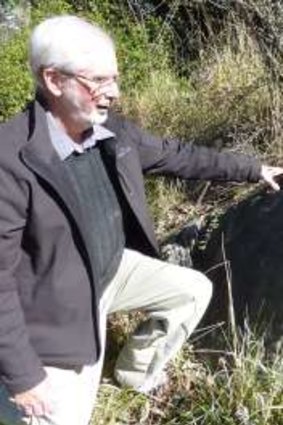 Dr Doug Finlayson gets up close and personal with the limestone on Acton Peninsula