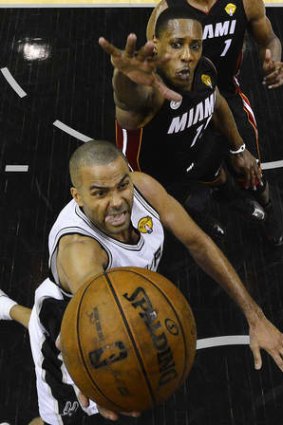 Global appeal: San Antonio Spurs guard Tony Parker shoots as Miami Heat's Mario Chalmers defends during the NBA Finals in June.
