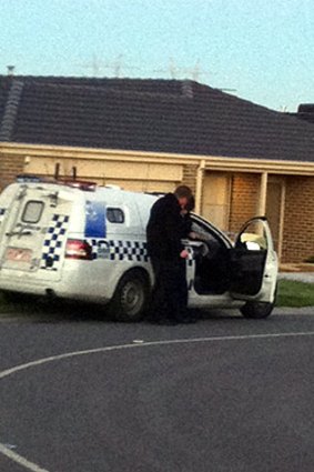 Police officers outside the house in Cranbourne.