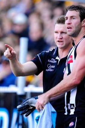 Pie problems: Nathan Buckley (left) and Travis Cloke.