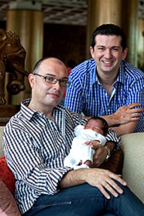 Darren and John Allen-Drury, with their son, Noah, who was born in India to a surrogate.