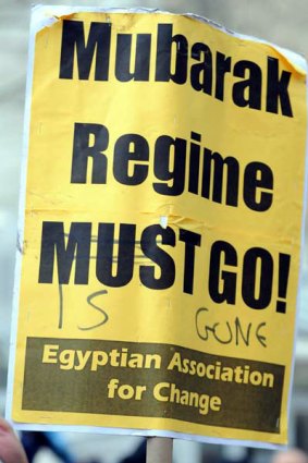 A sign's message is updated at a rally formed by a coalition of Egyptian-American groups