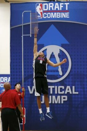 Dante Exum leaps in the vertical jump in the 2014 NBA basketball draft combine in Chicago.