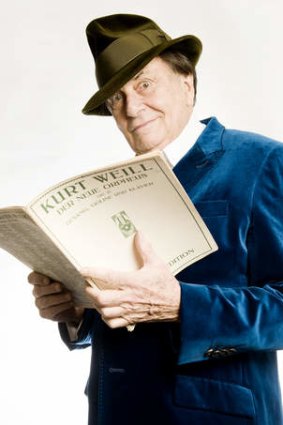 Barry Humphries, at home in London this week, with sheet music by Kurt Weill.