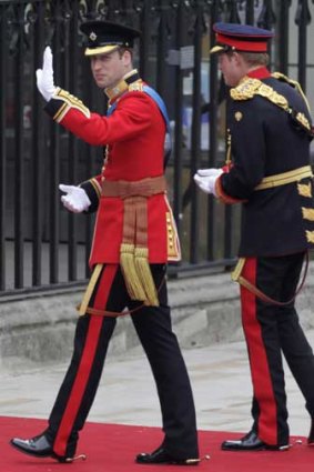 Resplendent in a red military tunic, Prince William and his brother Harry, both officers in the armed forces, look impeccable as they arrive at Westminster Abbey.