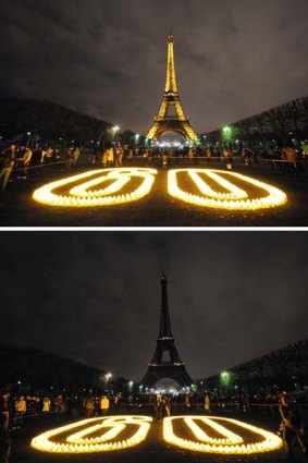 A combination picture shows the Eiffel Tower submerging into darkness as part of the Earth Hour.