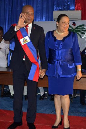 Michel Martelly accompanied by his wife Sophia after being sworn in as Haiti's president in Port-au-Prince, Haiti.