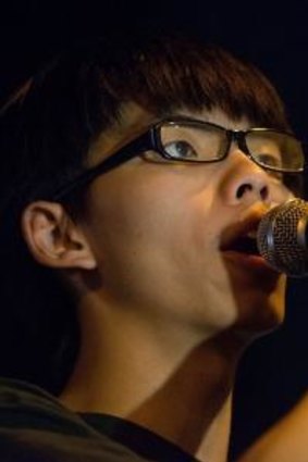 Joshua Wong speaks to protesters outside Hong Kong Government Complex.