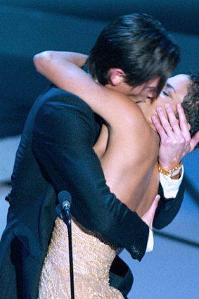 Adrien Brody celebrates his best actor win by passionately kissing Halle Berry.