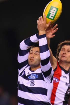 Jimmy Bartel of the Cats and Farren Ray of the Saints compete for the ball.
