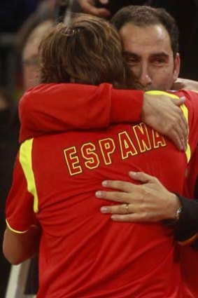 David Ferrer embraces his captain Albert Costa after defeating Juan Martin del Potro.