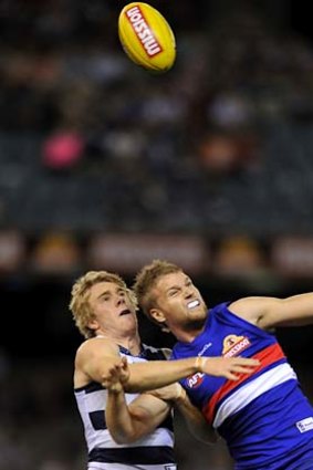 Cat and Dog fight: Cameron Guthrie (left) and Jake Stringer duel for a mark.