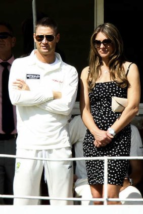 Michael Clarke watches on with Elizabeth Hurley during a charity match between Shane Warne's Australia and Michael Vaughan's England.