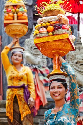 Women with Temple offerings, Ubud, Bali.