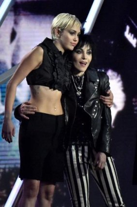 Miley Cyrus (left) and inductee Joan Jett of Joan Jett and The Blackhearts.