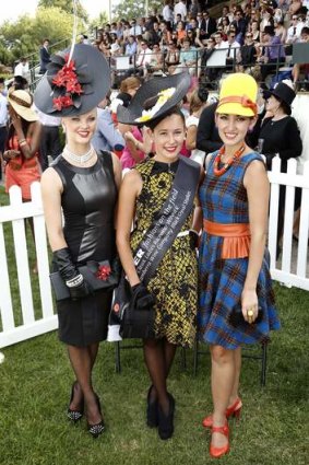 Fashions on the Field winners, from left, second place Kody-Leigh Hirst from Stirling, first place Viviane Parish from Bywong and third place Angela Menz from Chifley during the Black Opal Stakes at Thoroughbred Park in Canberra.