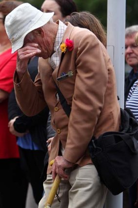 A Wellington man shows his emotion as New Zealand holds two minutes' silence at 12.51pm to mark the time of last week's Christchurch earthquake.