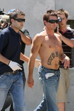 Ben Cousins led away by Police in 2007.