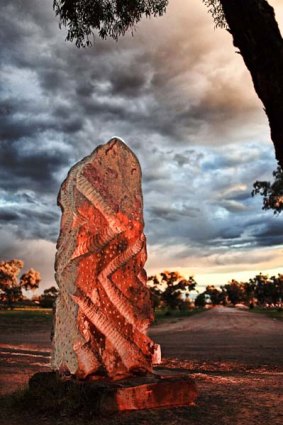 In memorium ... the grave of eye surgeon Fred Hollows is marked by a sculpted monument.