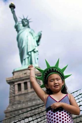 Photo opportunity: Statue reopens after Sandy.