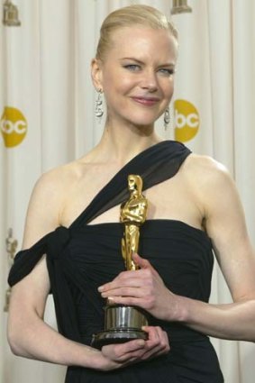 All smiles ... Nicole Kidman poses after winning an Oscar for her role in <i>The Hours</i>.