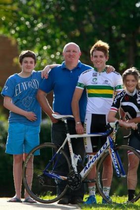 Jack Cummings, a young cyclist who has just been signed by a German team, with his father Mick, brother Tom (left) and sister Georgia.