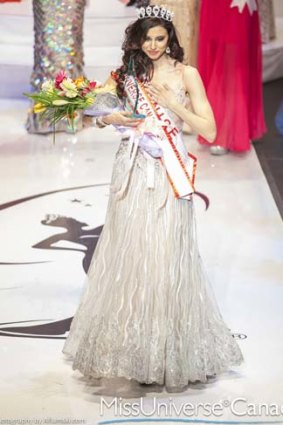 Stripped of her crown: Denise Garrido celebrates after being told she was the winner.