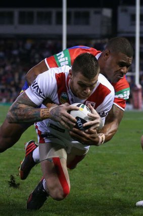 Game-breaker: Josh Dugan crashes over during his standout performance.