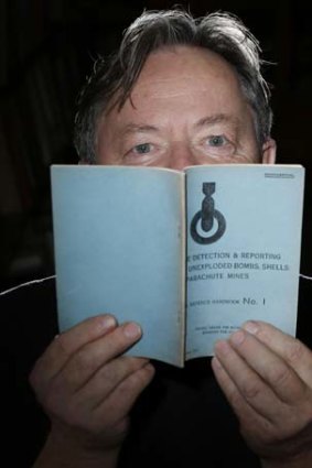 Simon Maddox with one of the 21 military doctrine training pamphlets that were seized by military police.