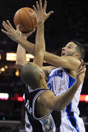 New Orleans Hornets point guard Greivis Vasquez (21) shoots over San Antonio Spurs point guard Tony Parker.