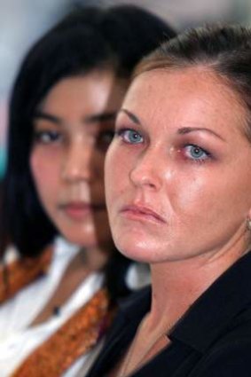 Schapelle Corby sits with her translator during her trial in a Denpasar court on the Indonesian resort island of Bali May 27, 2005.