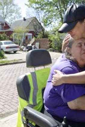 Unrivalled joy: Neighbour Sandra Guisao hugs Deborah Knight, grandmother of Michelle Knight.