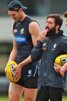 Call up: Robbie Warnock (left) with Kade Simpson and Bryce Gibbs at Carlton training on Friday.