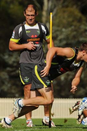 Raring to go: Terry Campese holds the stop watch on Sam Williams at Raiders training.